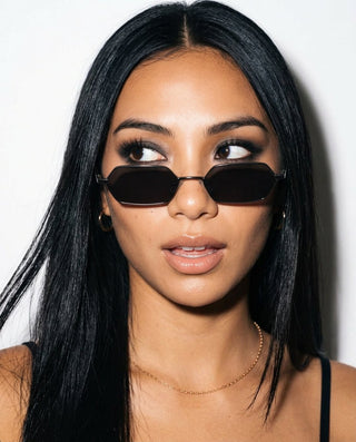 Woman wearing COCO Gunmetal hexagonal sunglasses